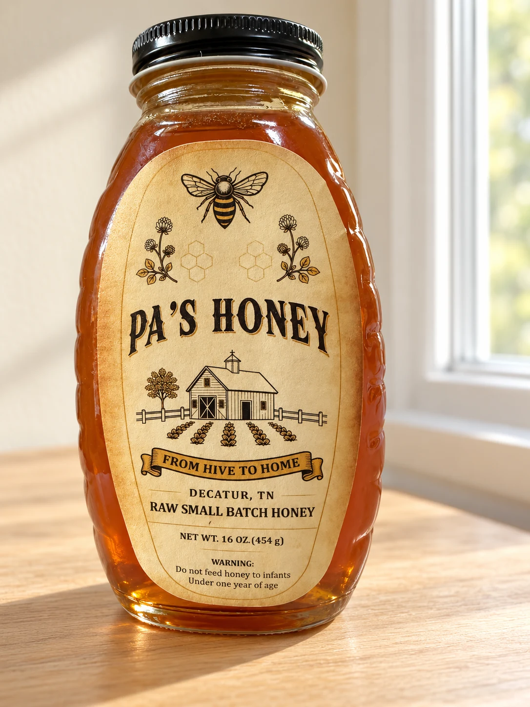 A jar of Pa’s Honey with its parchment farm label, beside a sunlit window